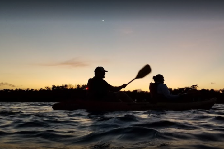 a sunset over a body of water