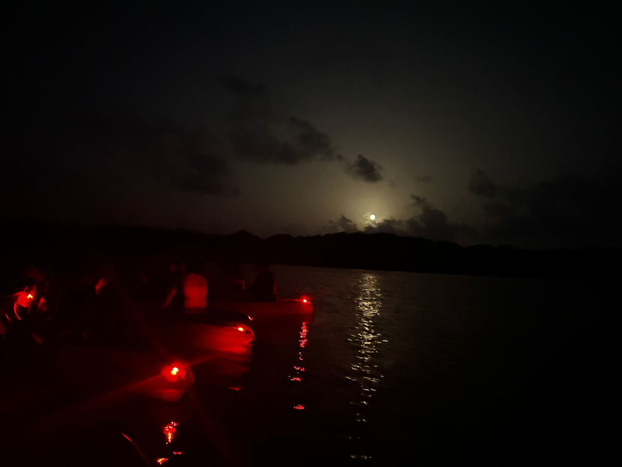 a group of clouds in the dark