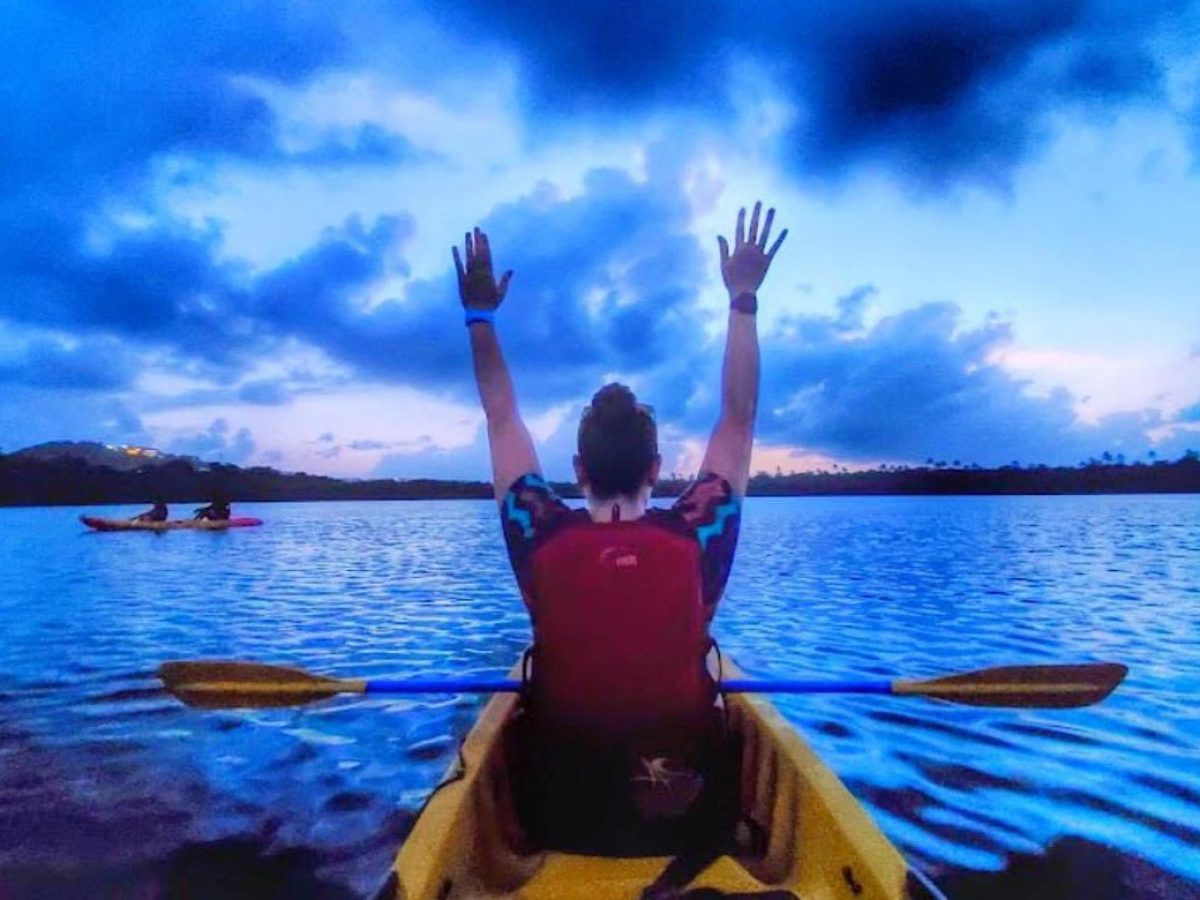 a person standing in front of a body of water