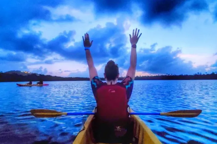 a person standing in front of a body of water
