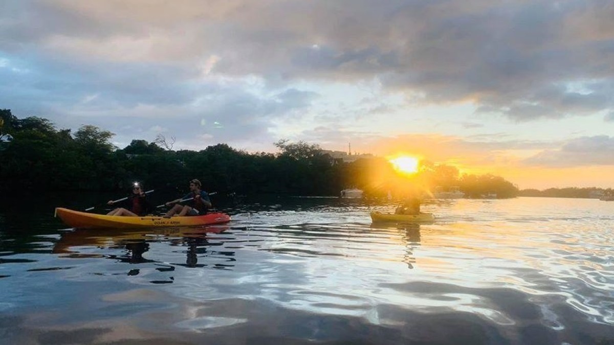 a group of people on a boat in the water