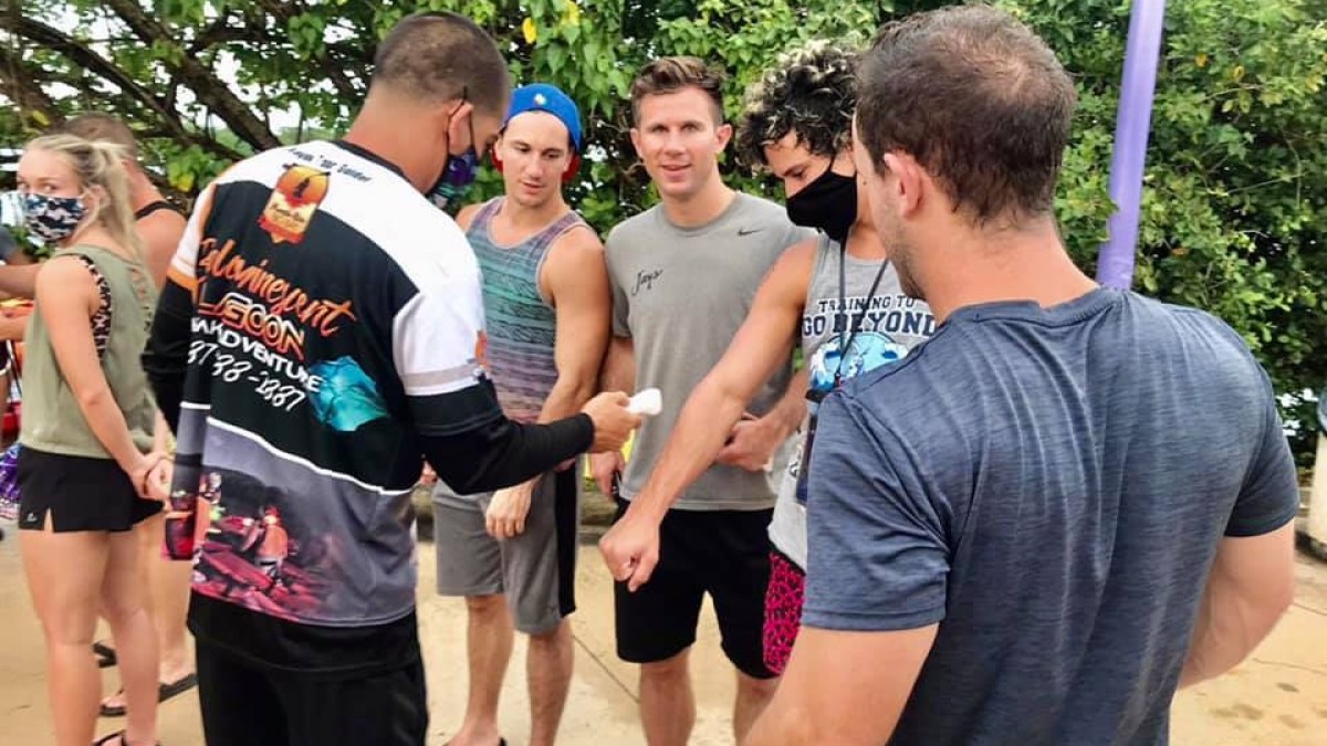 a group of people standing in front of a crowd