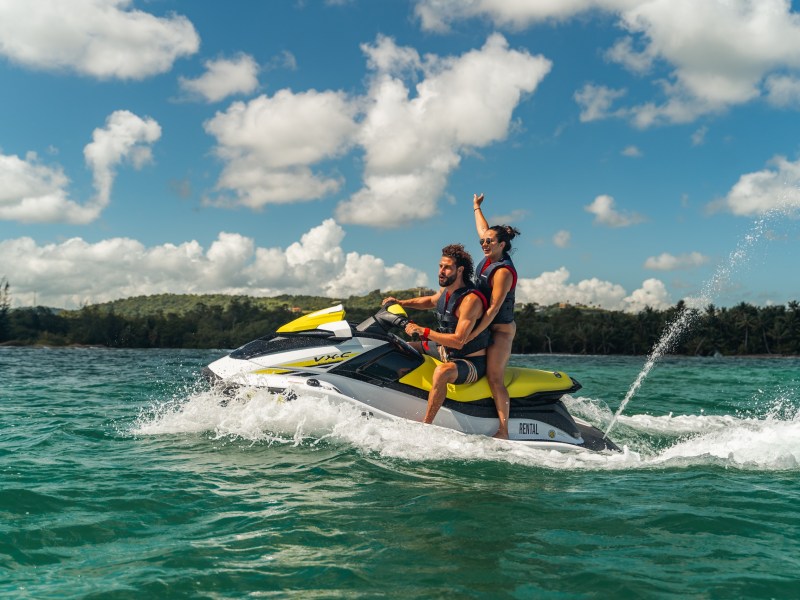 a man water skiing behind a boat