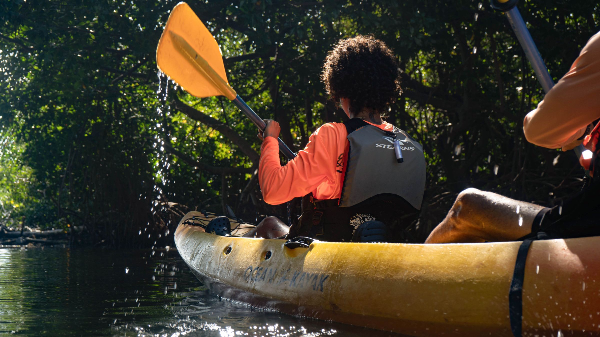 a man riding on the back of a boat